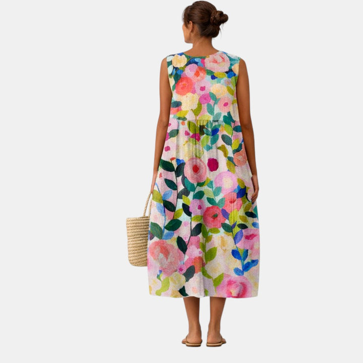Abito midi donna senza maniche con stampa floreale colorata, per un look primaverile e vacanziero.
