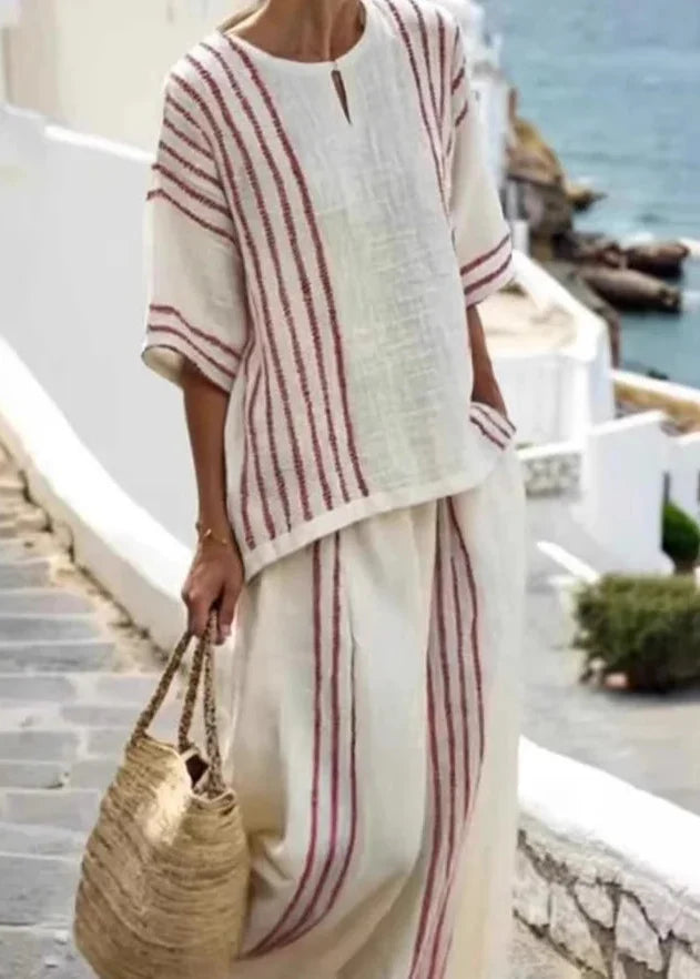 Completo estivo donna a righe, due pezzi comodi. Top senza maniche e pantaloni ampi per un look casual.