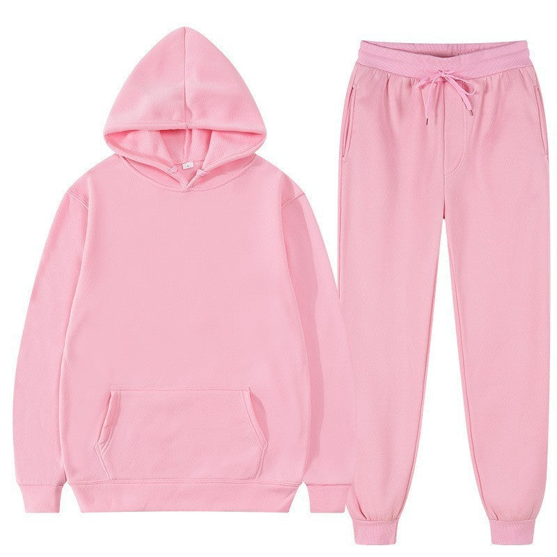 Tuta sportiva uomo con cappuccio e pantaloni lunghi, vestibilità larga per un comfort eccellente in autunno.
