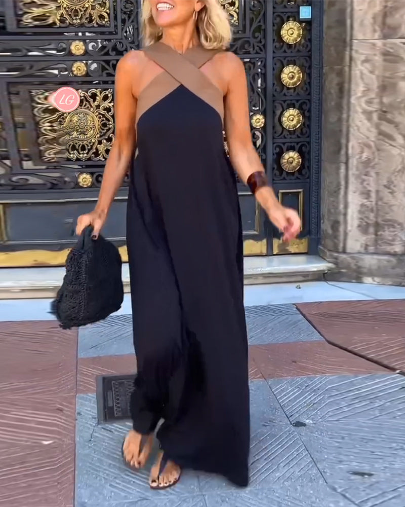 Maxi abito incrociato da cerimonia, scollo a V e tessuto fluido. Perfetto per look sofisticati.