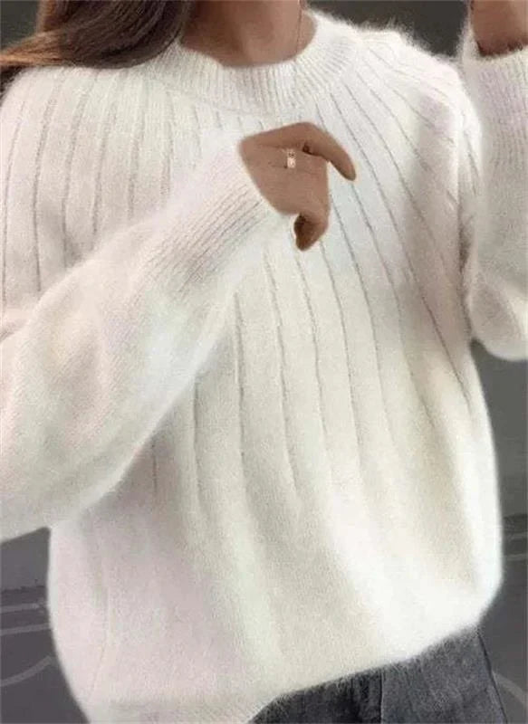 Moda donna autunno inverno: maglione caldo e versatile con maniche lunghe. Stile casual ed elegante per comfort.