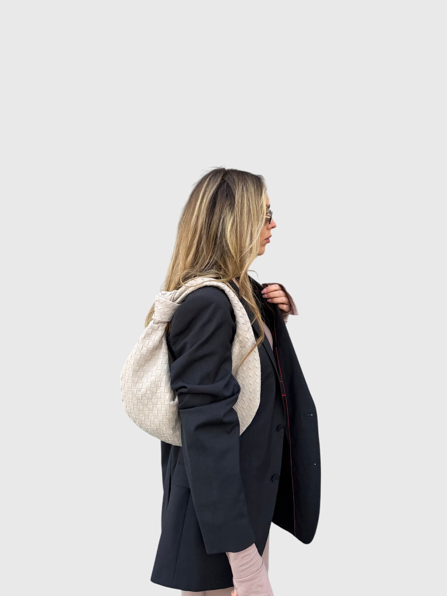 Borsa a mano media per donna in suede intrecciato, finitura raffinata e nodo.