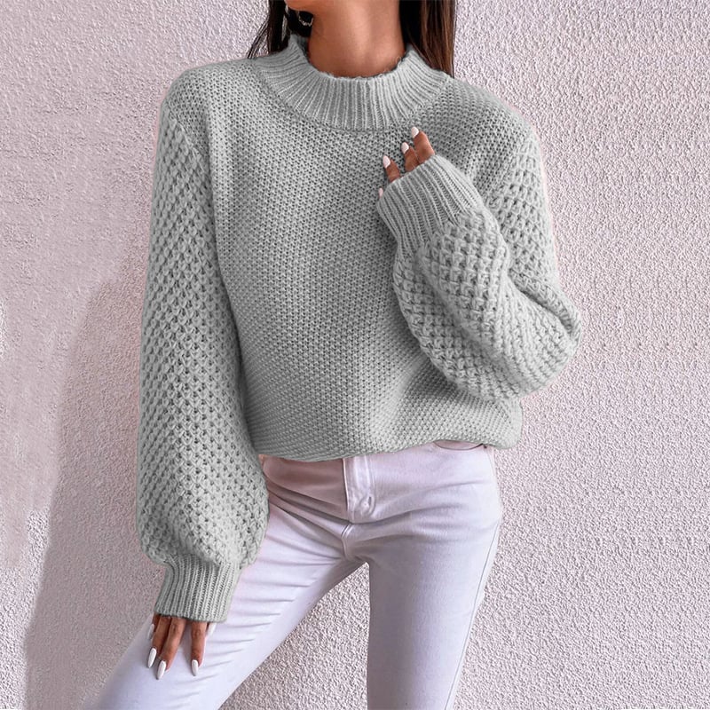 Elegante maglione donna autunnale a maniche lunghe, motivo geometrico. Vestibilità ampia, capo versatile e casual.