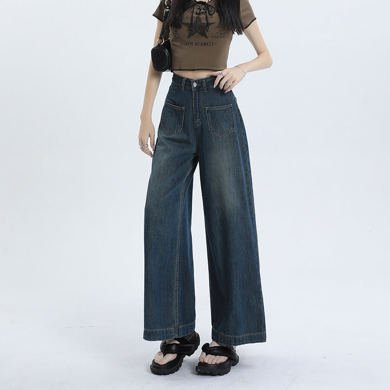 Pantaloni jeans donna a vita alta retrò, gamba dritta larga in denim blu scuro, perfetti per look casual ed eleganti.