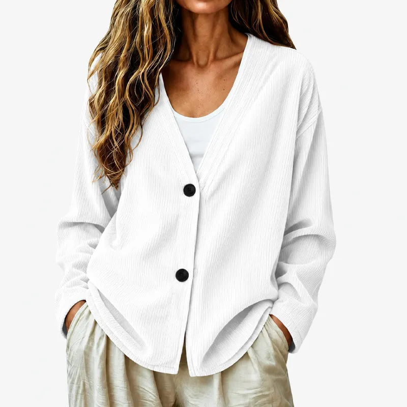 Cardigan donna primaverile a coste, scollo a V e bottoni. Look elegante e confortevole.