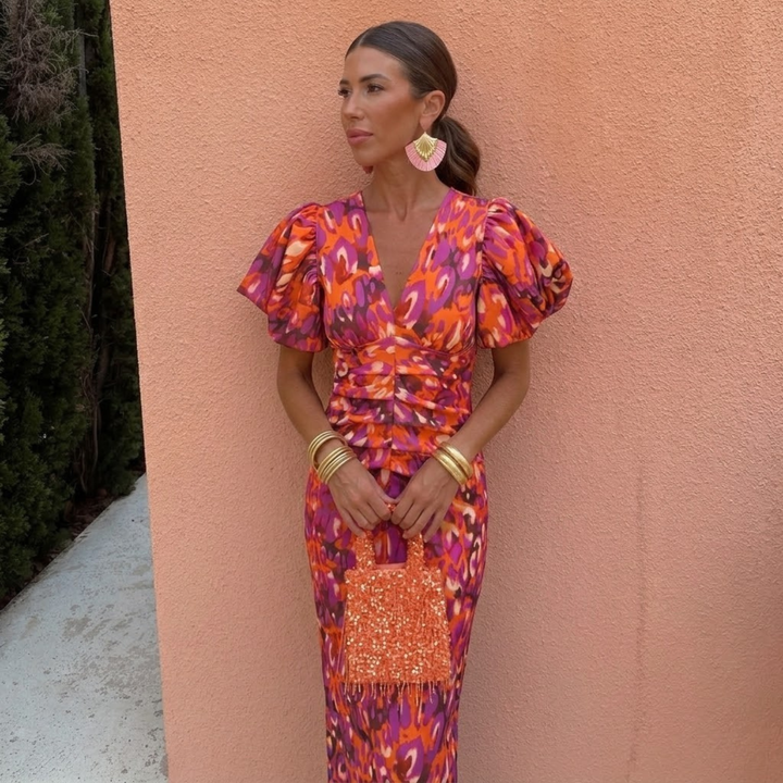 Vestito donna colorato per primavera/estate, con scollo a V e maniche a sbuffo, stile elegante.