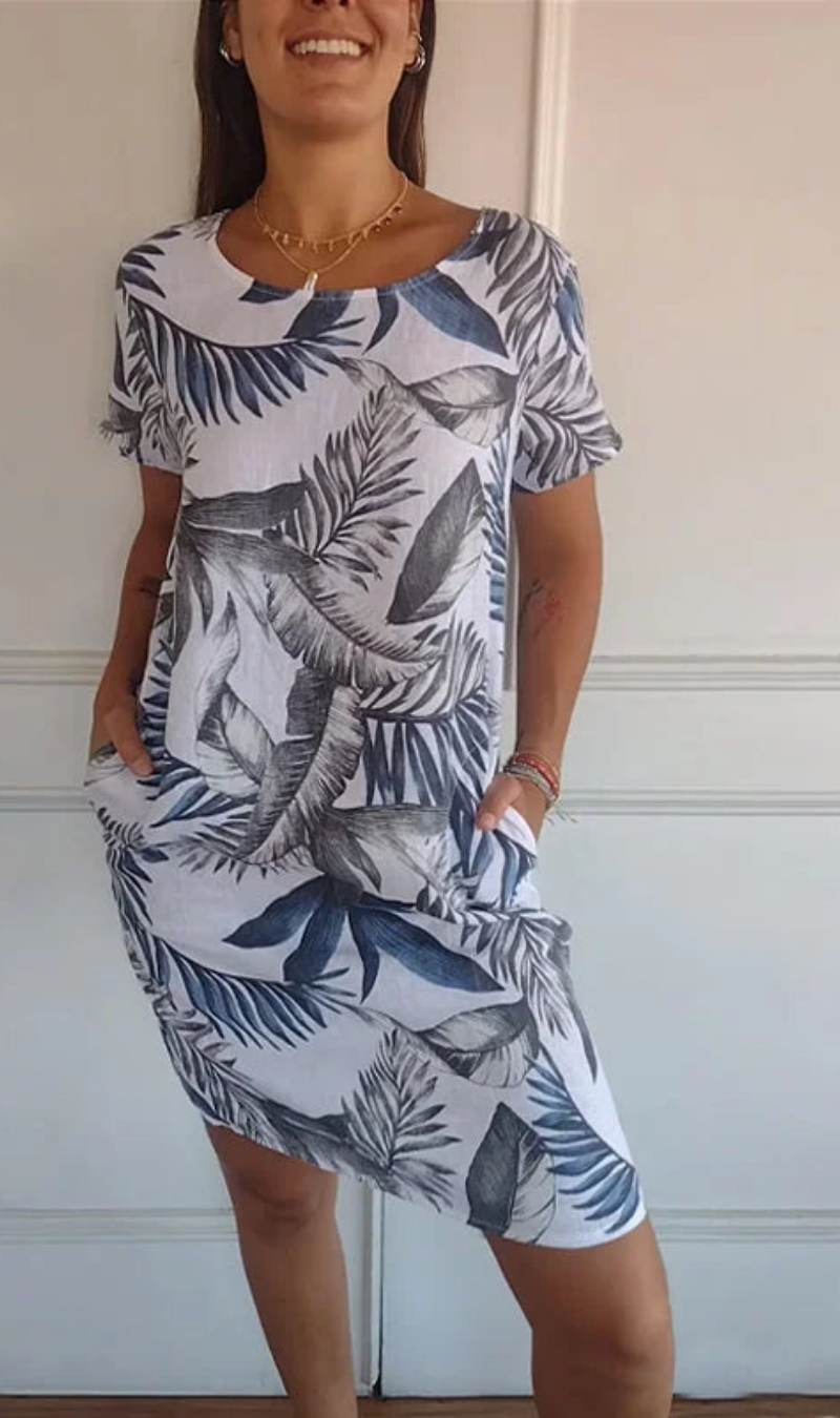 Abito casual donna con stampa botanica, modello fluido e tasche, perfetto per le giornate di sole.