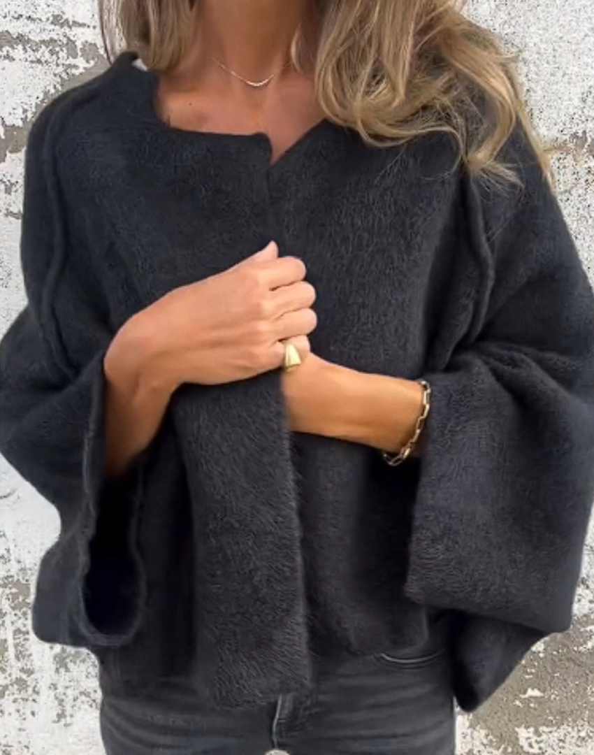 Cardigan donna aperto oversize, ideale per un look casual chic. Caldo e versatile, aggiunge eleganza all'outfit.