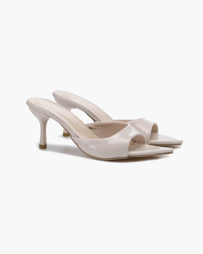 Sandali neri slip-on donna, tacco kitten heel elegante, ideali per un look sofisticato.