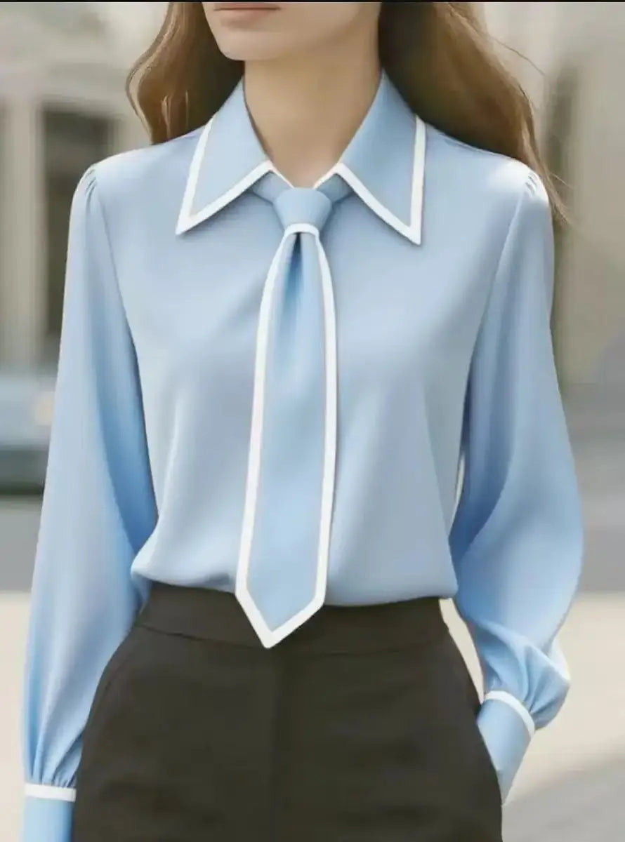 Elegante camicetta donna a maniche lunghe, colletto a contrasto. Blusa versatile, perfetta per ufficio o eventi chic.