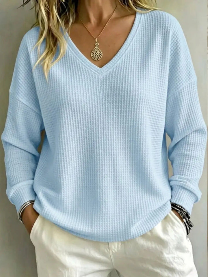 Pullover donna casual, scollo a V e stile comodo per un'eleganza disinvolta.