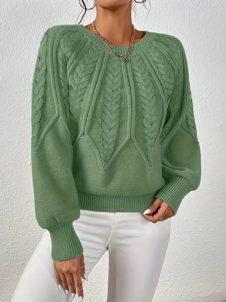 Maglione comodo per donna, design a trecce e maniche a palloncino. Stile casual per l'autunno.