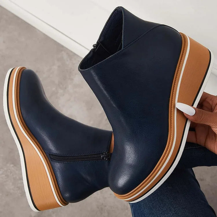 Dettaglio stivali alti donna in suede marrone scuro, lusso e calore per la moda femminile.