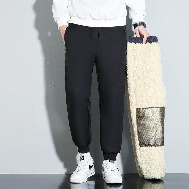 Pantaloni uomo invernali grigi, caldi e comodi, stile streetwear con ampia vestibilità e vita media, ideali per il freddo.