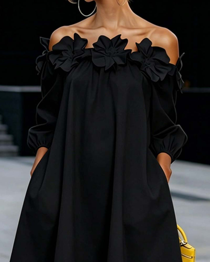 Abito donna unico con spalle scoperte e fiori 3D, perfetto per un look estivo elegante.