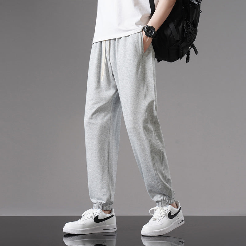 Pantaloni ampi uomo estivi con coulisse regolabile in vita e design alla caviglia per massimo comfort e stile.