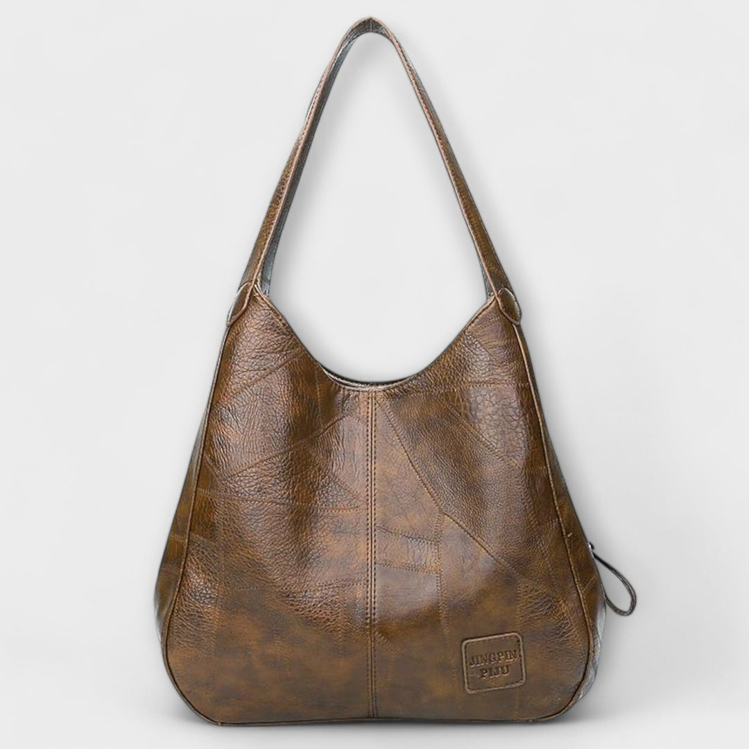 Borsa classica donna effetto pelle, design vintage per un accessorio di moda senza tempo.