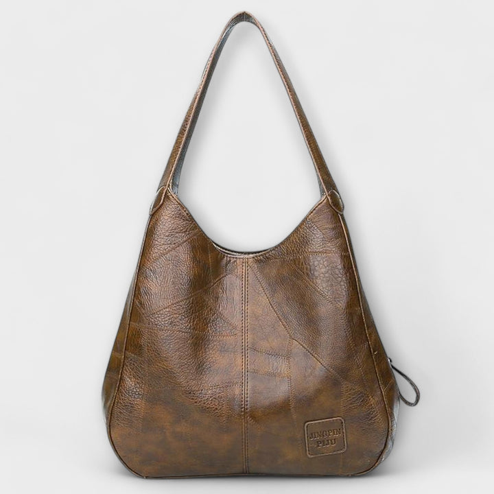 Borsa classica donna effetto pelle, design vintage per un accessorio di moda senza tempo.