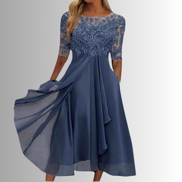 Abito midi donna elegante in pizzo nero con gonna fluida. Perfetto per serate e cerimonie speciali.