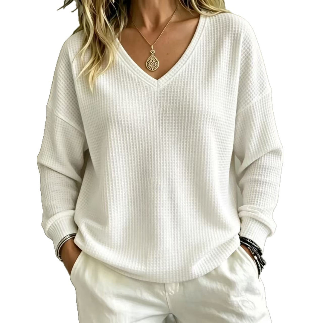Maglione casual donna, stile comodo con scollo a V profondo per eleganza quotidiana.