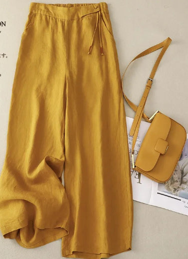 Pantaloni donna in lino a vita alta con gamba larga e tasche, ideali per primavera/estate e look casual.