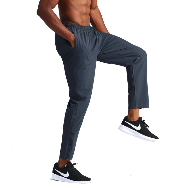 Pantaloni larghi da uomo in tessuto traspirante ad asciugatura rapida, ideali per basket e training fitness.