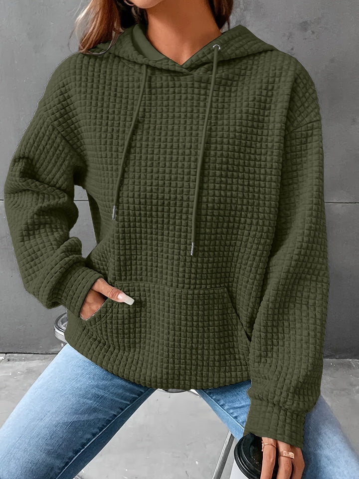 Abbigliamento donna: felpa con cappuccio, tasca marsupio, texture esclusiva. Versatile e comoda.