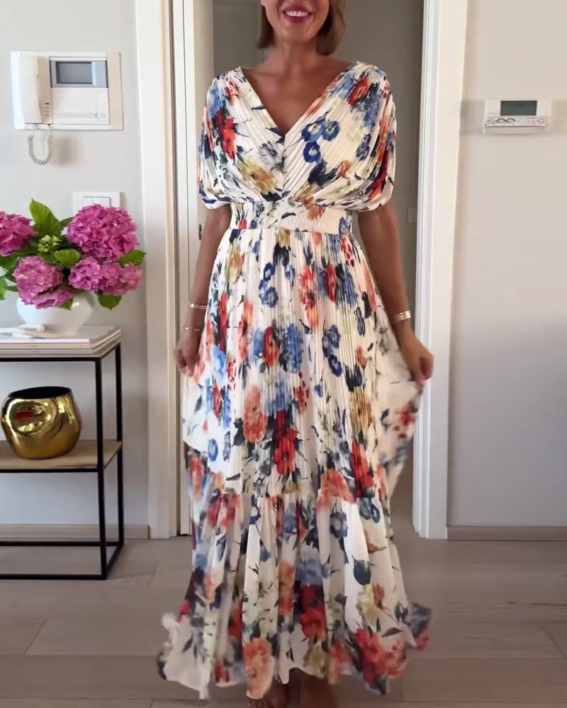 Abito donna elegante con motivo floreale, leggero, perfetto per un look raffinato, estivo o casual chic. Abbigliamento moda.