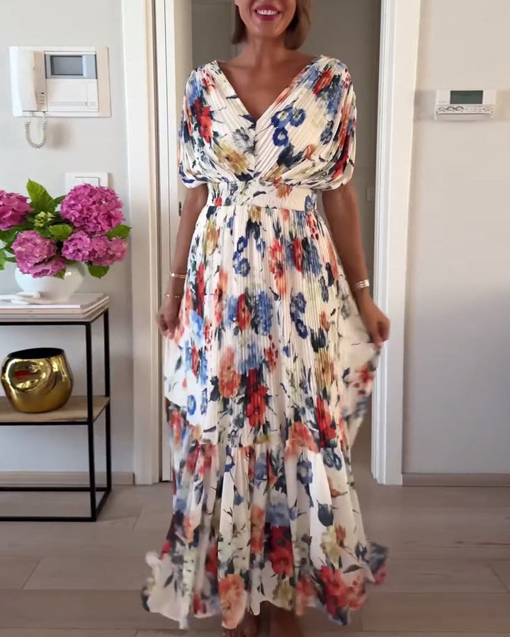 Abito donna elegante con motivo floreale, leggero, perfetto per un look raffinato, estivo o casual chic. Abbigliamento moda.