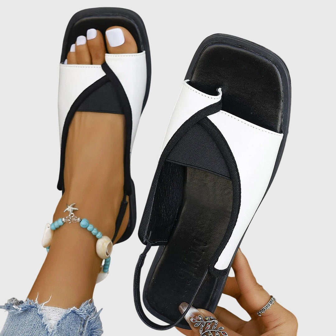 Sandali bassi estivi da donna, stile slingback casual-chic, perfetti per giornate di moda e relax.