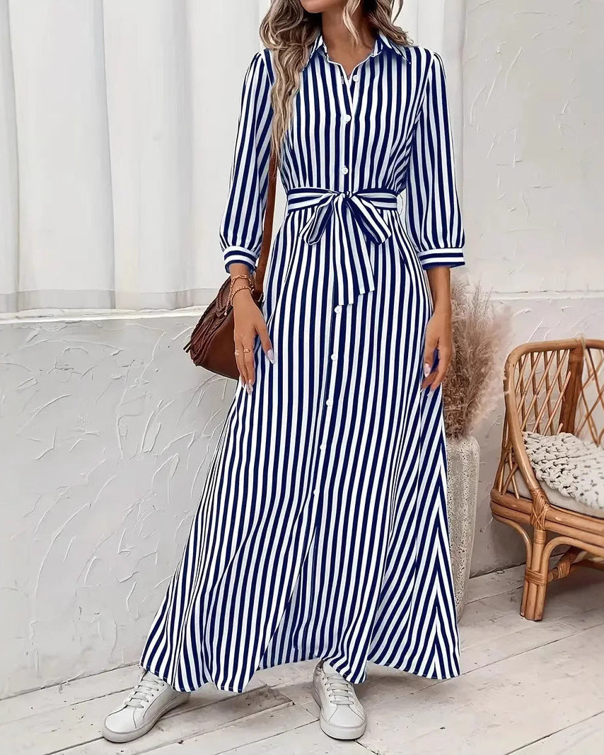 Abito camicia donna a righe, stile moderno con colletto a rever, bottoni e taglio lungo, per un look sofisticato.