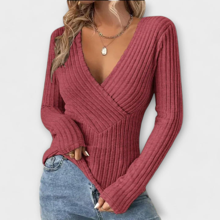 Morbido maglione donna con scollo a V e raffinata trama intrecciata. Maniche lunghe, ideale per abbigliamento casual.