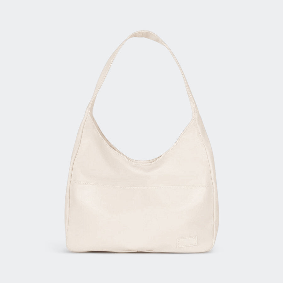 Borsa tracolla donna in pelle, design minimalista, spaziosa per essenziali quotidiani.