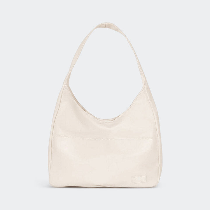 Borsa tracolla donna in pelle, design minimalista, spaziosa per essenziali quotidiani.