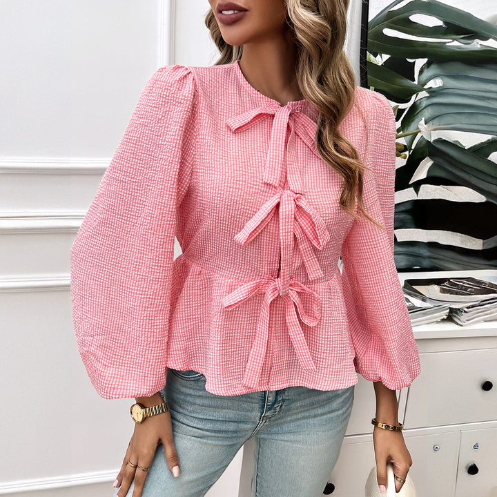 Elegante camicia donna a manica lunga a righe, con dettaglio lacci per un look versatile e alla moda.