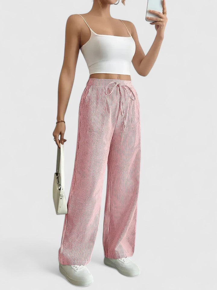 Pantaloni donna classici, vita alta con laccio, gamba larga. Per un look estivo versatile e comodo.