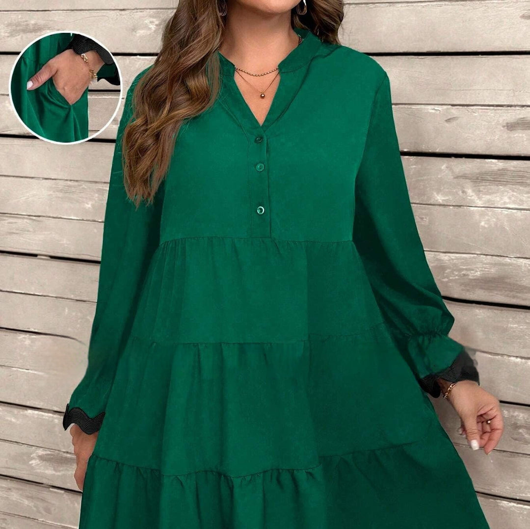 Vestito midi donna versatile e chic, con scollo a V e maniche lunghe. Ideale per un look di moda raffinato.