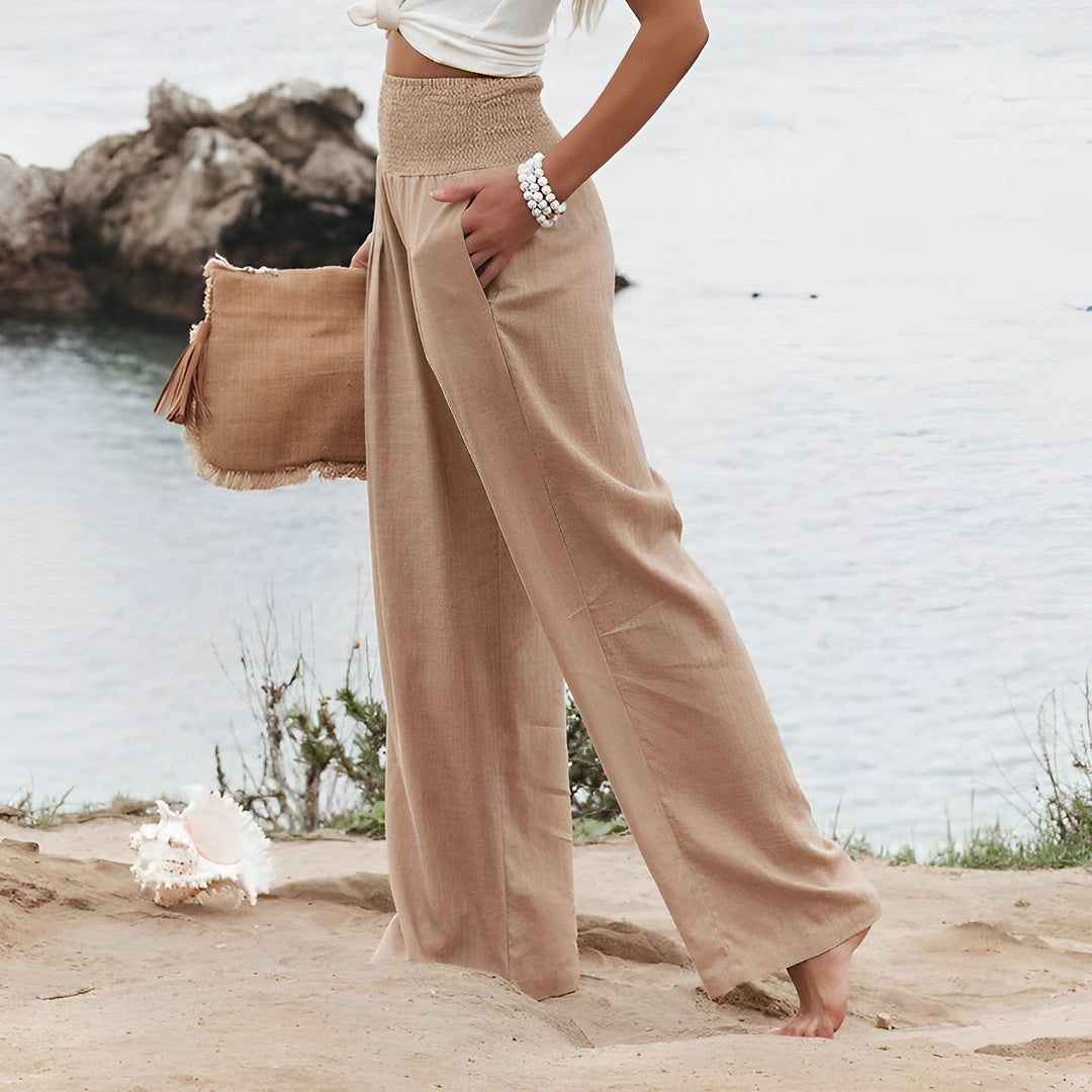 Pantaloni palazzo donna vita alta estivi, larghi e fluidi, perfetti per look casual chic primavera estate.