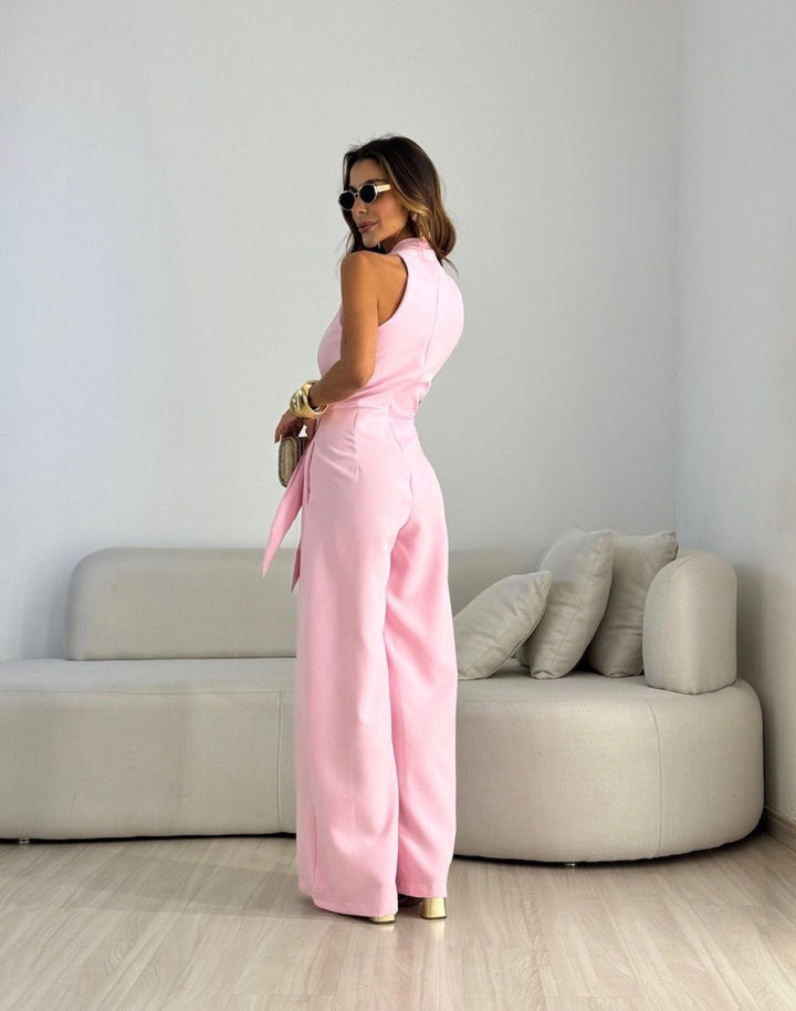 Tuta donna fluida, elegante e versatile con schiena scoperta, perfetta per varie occasioni serali.