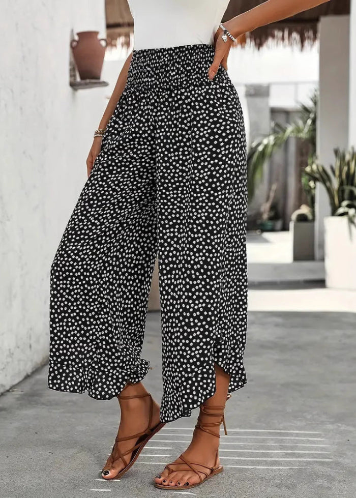 Eleganti pantaloni palazzo a pois per donna, a vita alta e gamba larga. Perfetti per look casual primavera estate.