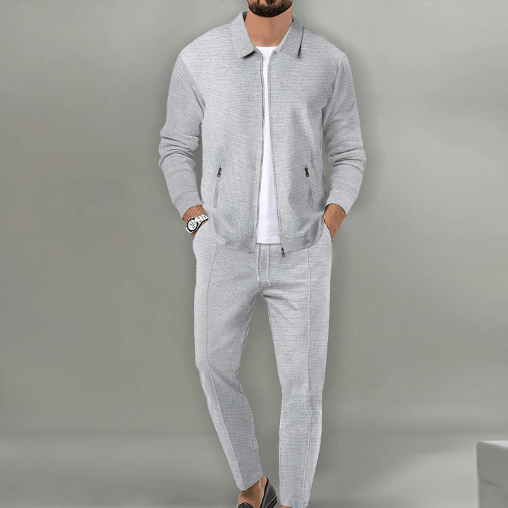 Tuta uomo comoda e versatile, set completo con maglia e pantaloni, ideale per sport, casa o abbigliamento casual.
