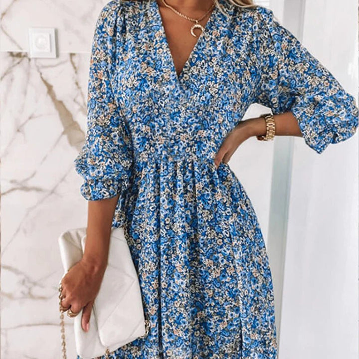 Vestito midi donna con vibrante stampa floreale, ideale per la primavera e l'estate, unisce stile casual ed elegante.