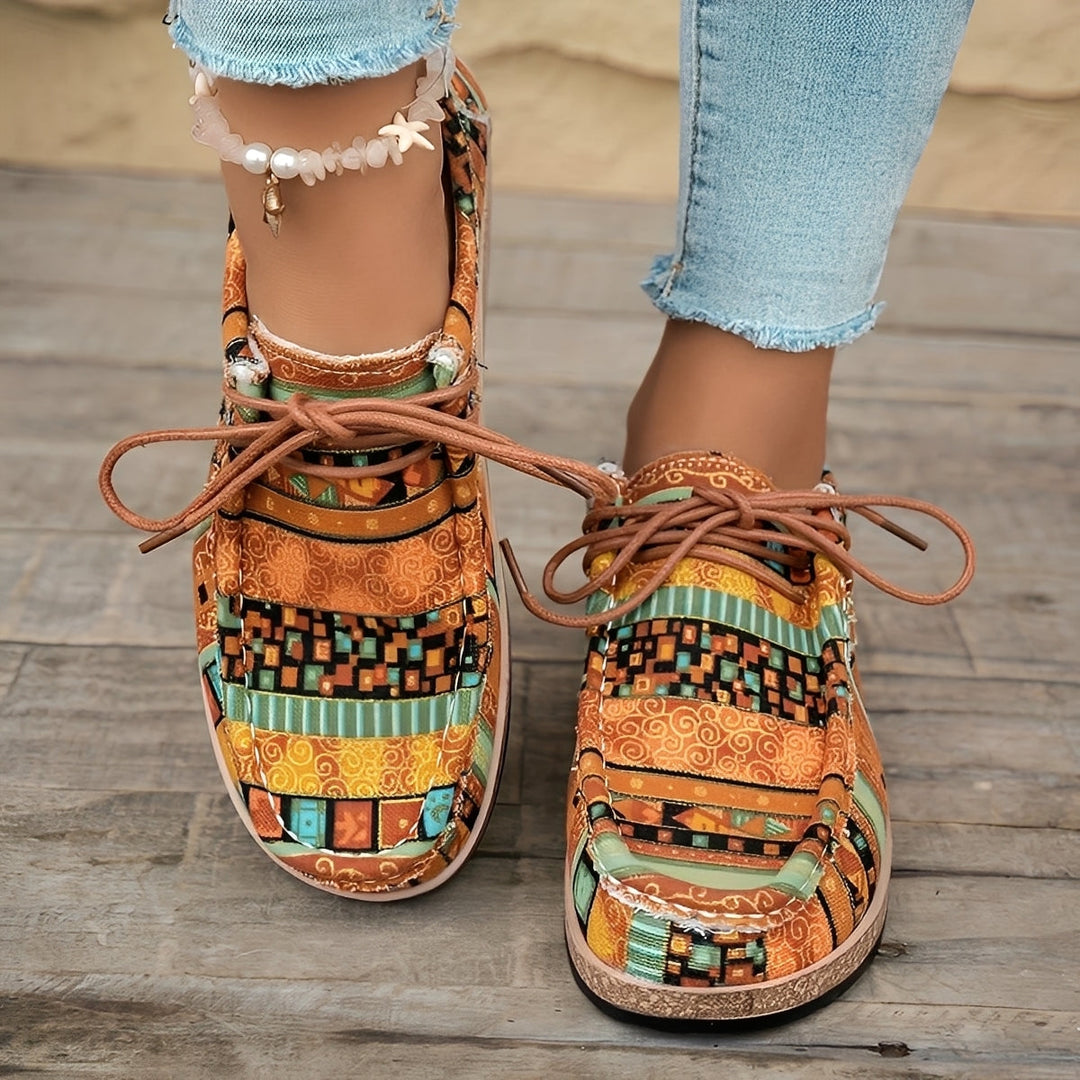 Sneakers donna artistiche ammortizzate per comfort quotidiano e passeggio. Design leggero e casual.
