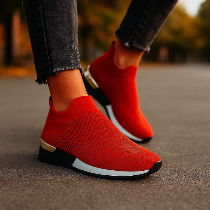 Sneakers donna slip-on rosa con tallone metallizzato, comode e traspiranti. Perfette per moda urbana.