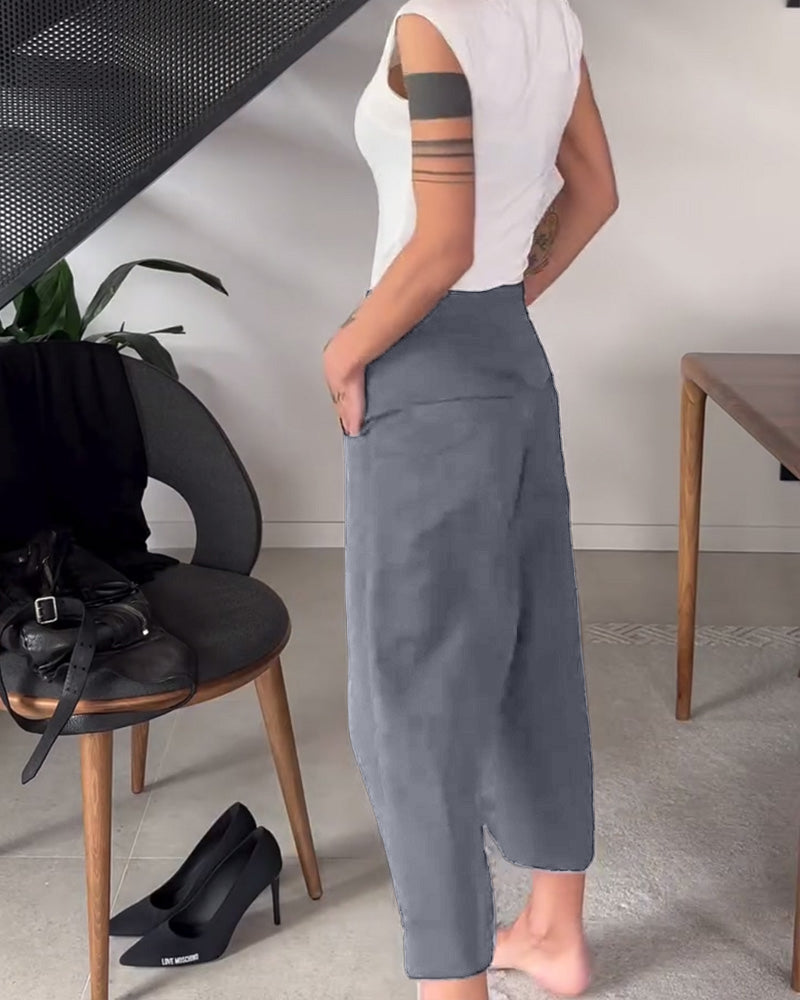 Comfort e stile nei pantaloni larghi asimmetrici da donna neri, ideali per ogni occasione.