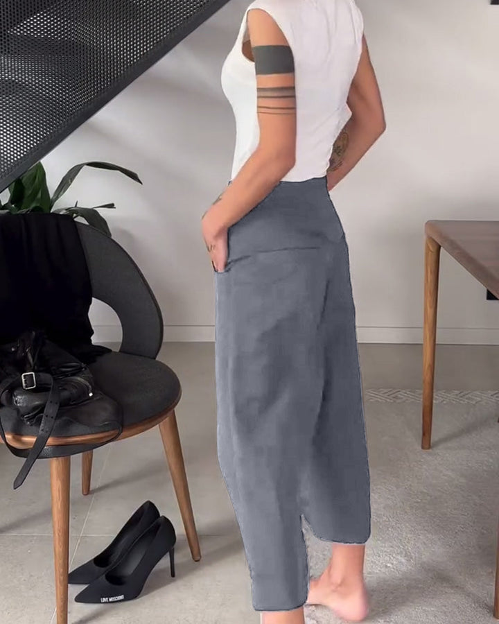 Comfort e stile nei pantaloni larghi asimmetrici da donna neri, ideali per ogni occasione.