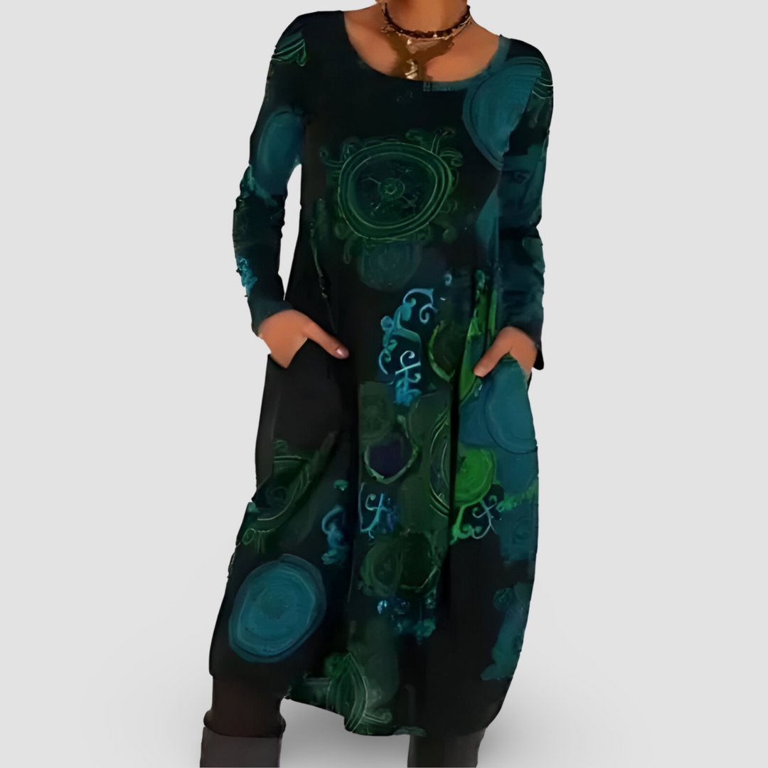Vestito donna maxi boho chic autunnale con tasche e motivi artistici. Look elegante e comodo per ogni occasione.