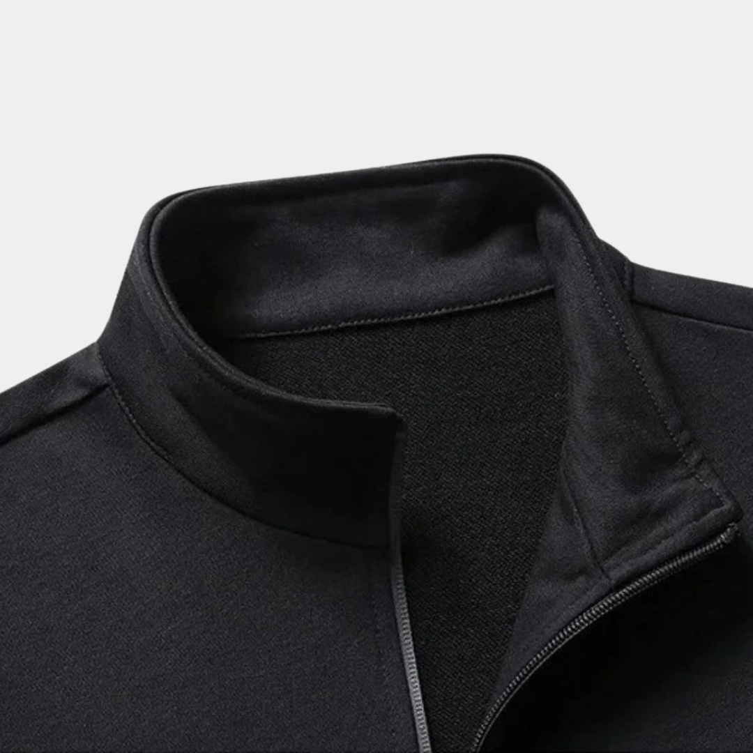 Tuta uomo sportiva moderna, giacca con zip integrale e pantaloni jogger per un look casual e confortevole.
