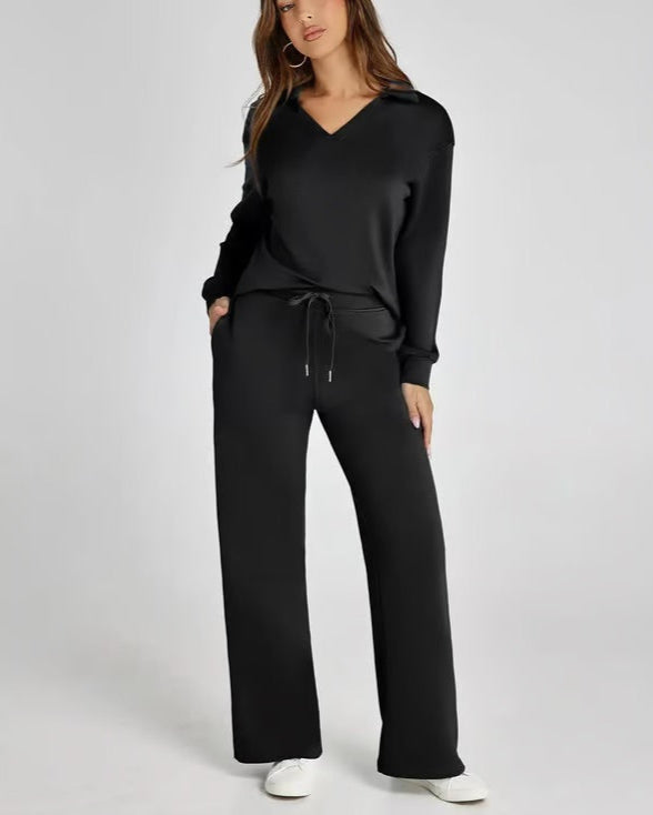 Completo casual donna: felpa a V e pantaloni larghi, per un look moderno e confortevole.