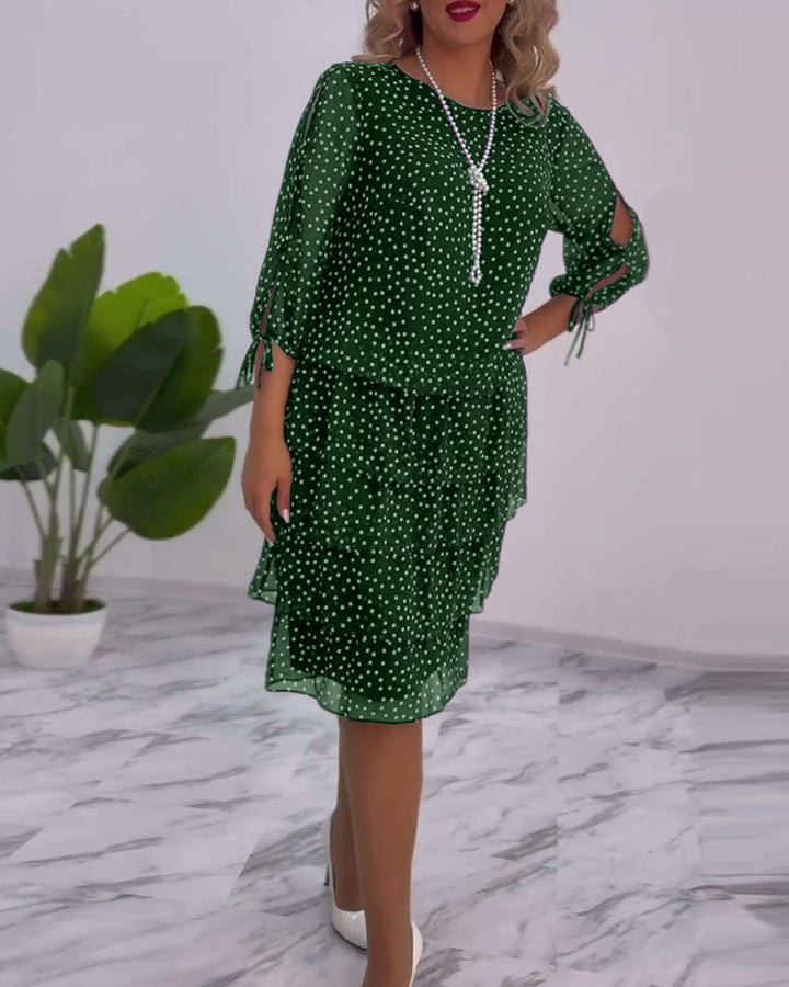 Abito donna a pois, gonna fluida. Vestito elegante con maniche a tre quarti per un outfit chic e moda autunno.